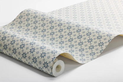  Set on a natural background with muted blue detailing, our Stella wallpaper balances structure and whimsy perfectly. 