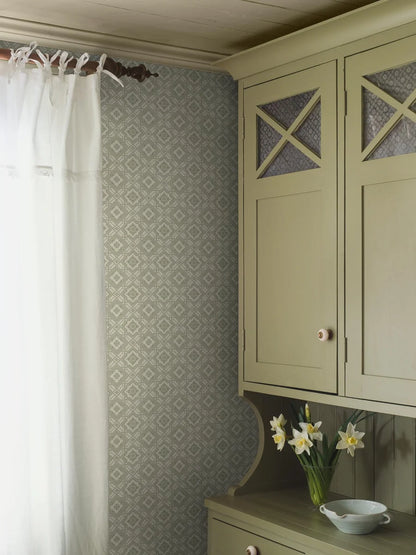 Colored in a mild green tone, our Friedrich wallpaper adds soft yet ordered charm to its surrounding space.