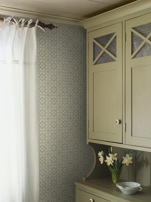 Colored in a mild green tone, our Friedrich wallpaper adds soft yet ordered charm to its surrounding space.