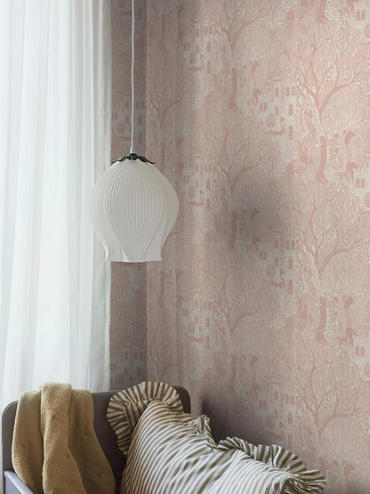 A fairy-tale scene unfolds in our Kingdom of the Willow wallpaper colored in soft warm pink on an eggshell-white background.