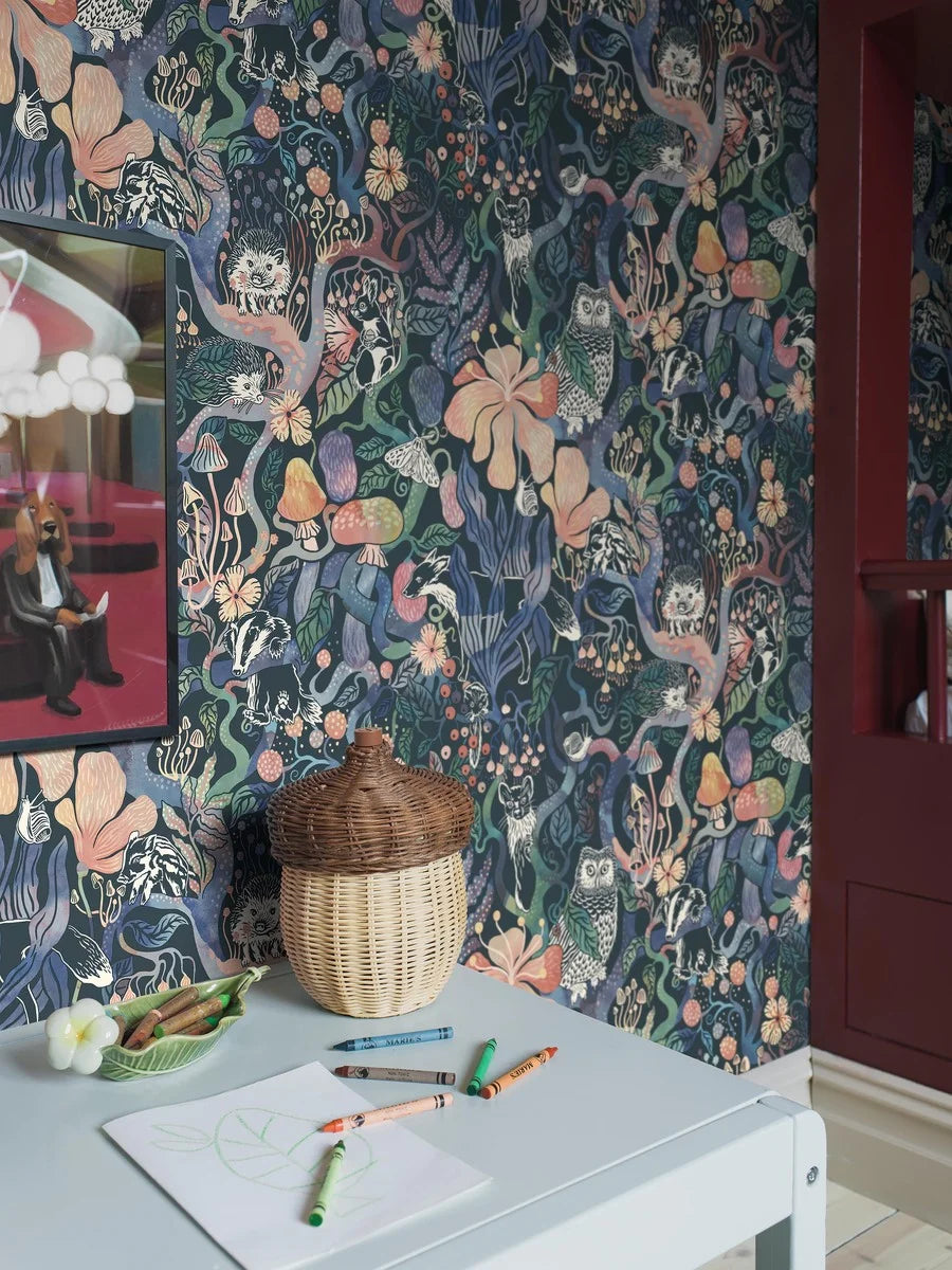 Colored in rich, dark tones of purple, pink, blue, and green on a deep blue-black background, our Magic Woods wallpaper is both organic and contemporary.