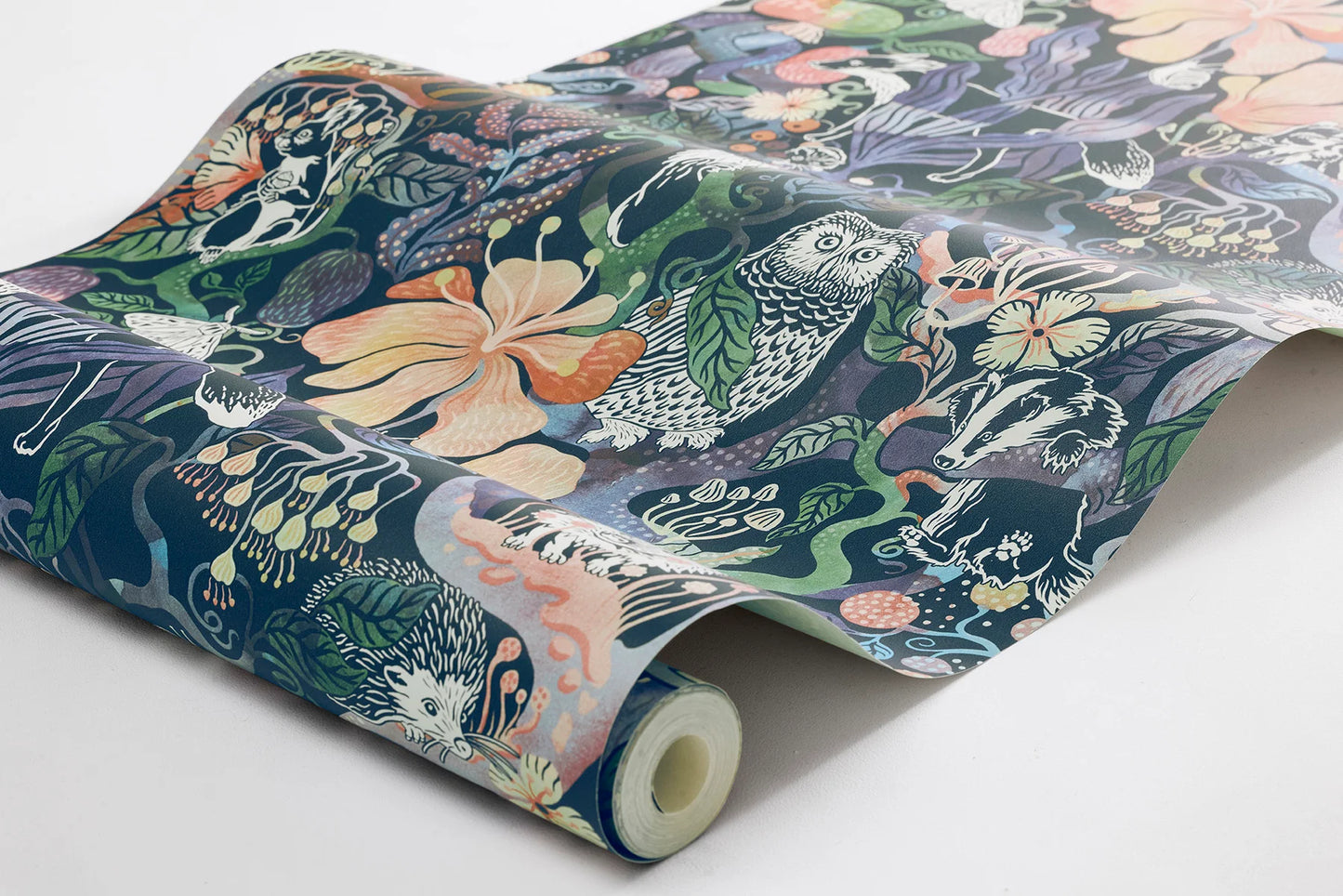 Colored in rich, dark tones of purple, pink, blue, and green on a deep blue-black background, our Magic Woods wallpaper is both organic and contemporary.