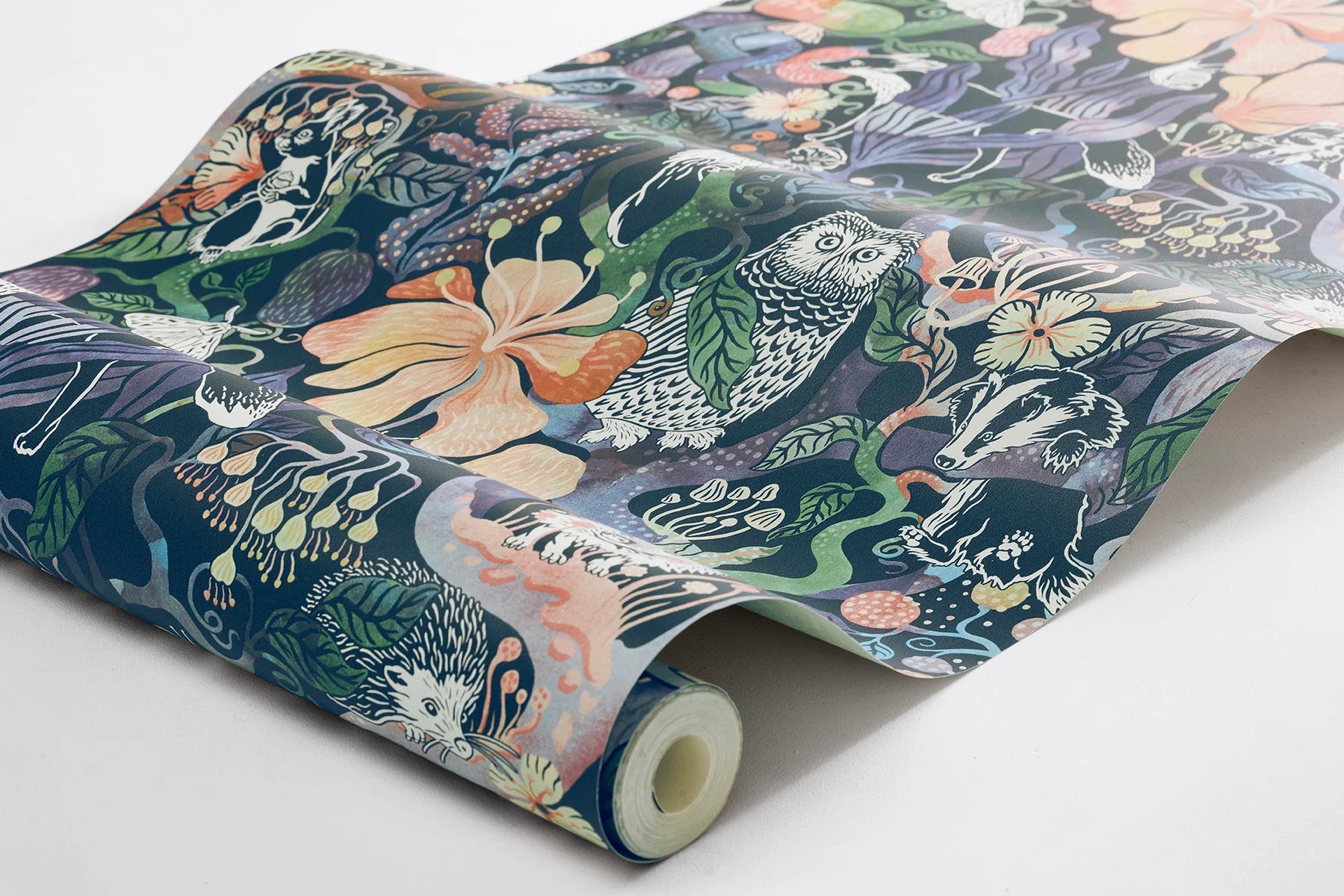 Colored in rich, dark tones of purple, pink, blue, and green on a deep blue-black background, our Magic Woods wallpaper is both organic and contemporary.