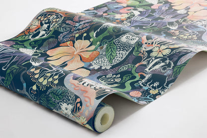 Colored in rich, dark tones of purple, pink, blue, and green on a deep blue-black background, our Magic Woods wallpaper is both organic and contemporary.