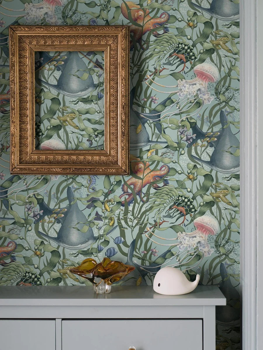 Dive into a vibrant underwater world set against an aqua-green background with our Underwater Magic wallpaper. 