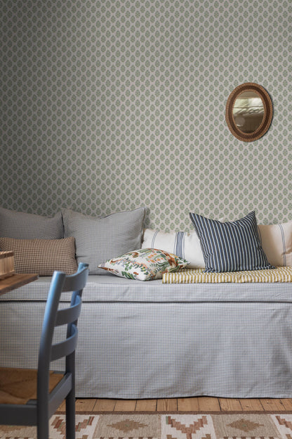 Sibylla wallpaper features small hand-drawn bouquets in gentle shades of blue and green set against a creamy white background, creating a light and calming expression.