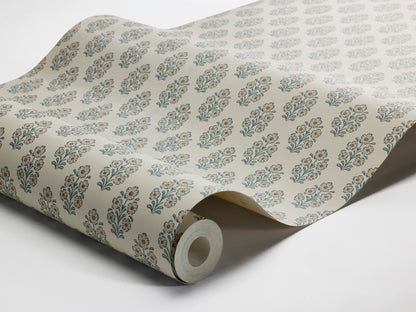 Set on a light linen-beige background, this Sibylla wallpaper features beige flowers with rust-brown centres and foliage in calm blue-grey tones.