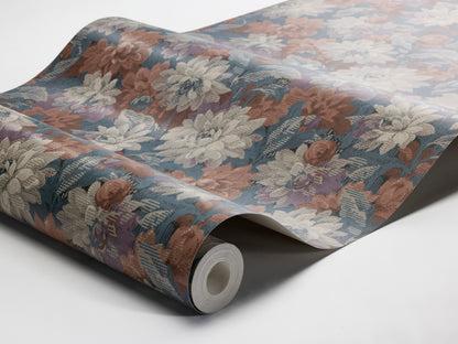 Colored in deep blue, brick red, and soft grey-purple tones, our Delilah wallpaper captures a dramatic and refined aesthetic. 