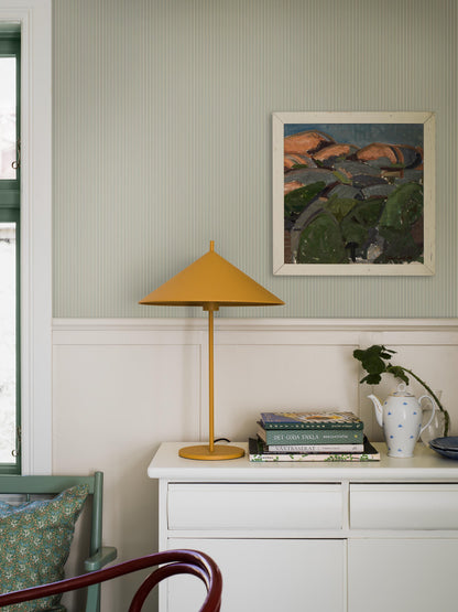 Colored in soft green tones, our Sam wallpaper features fine stripes in varying widths that flow gracefully down the wall.