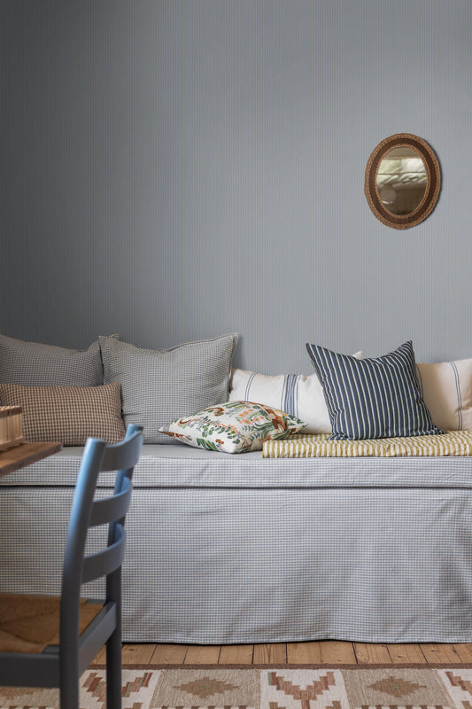 In delicate shades of blue and grey, this version of our Sam wallpaper captures the beauty of quiet simplicity.