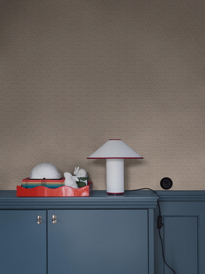 Colored in a light grey-beige tone, our Ida wallpaper reveals a delicate vine motif highlighted with pale red, grey-blue, and brown detailing. 