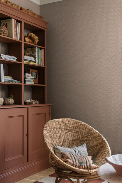 Colored in a light grey-beige tone, our Ida wallpaper reveals a delicate vine motif highlighted with pale red, grey-blue, and brown detailing. 