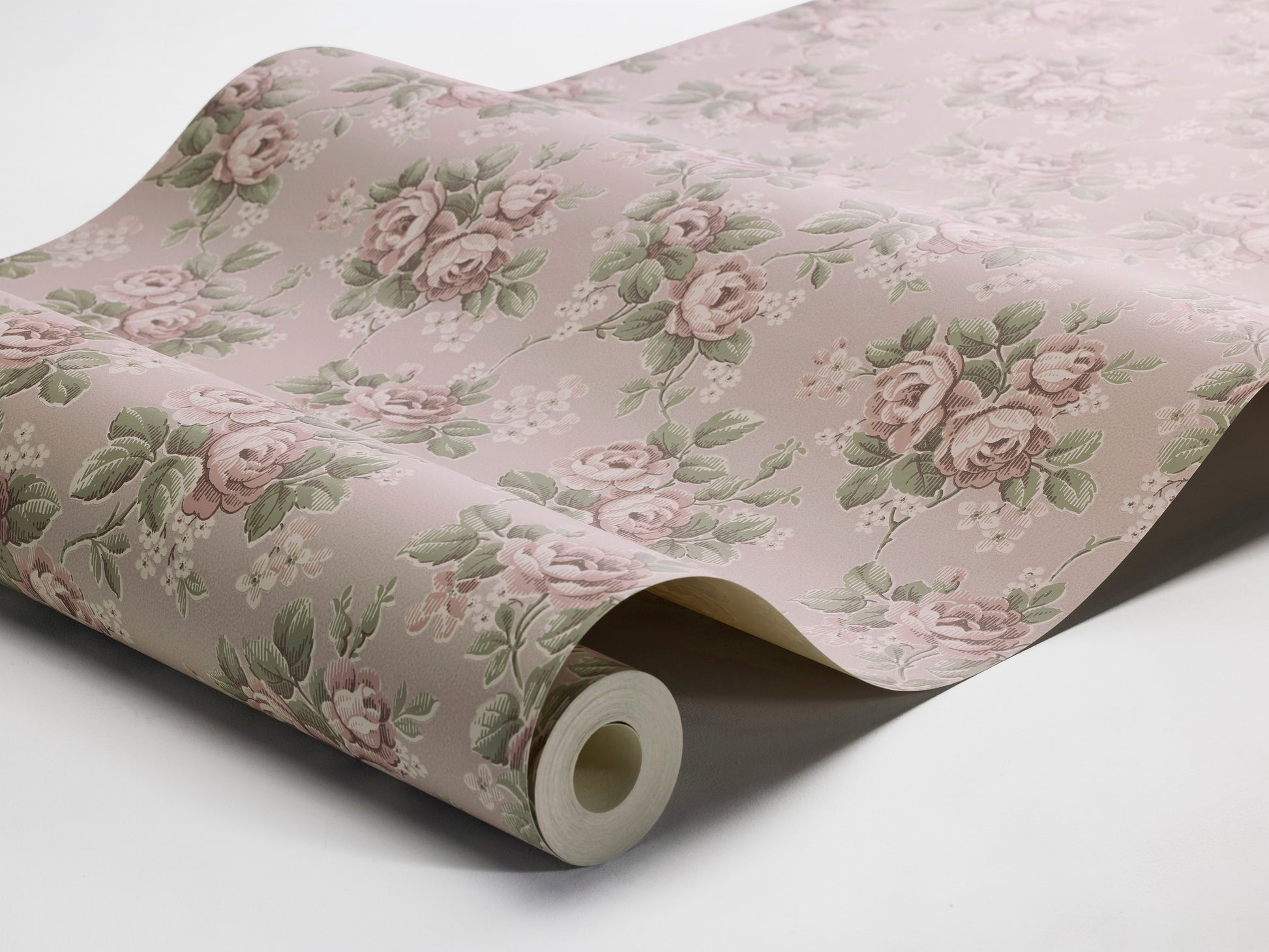 Set on a soft pink background with cool undertones, our Helena wallpaper features flowing rose bouquets in muted shades of pink, green, and cream-white. 