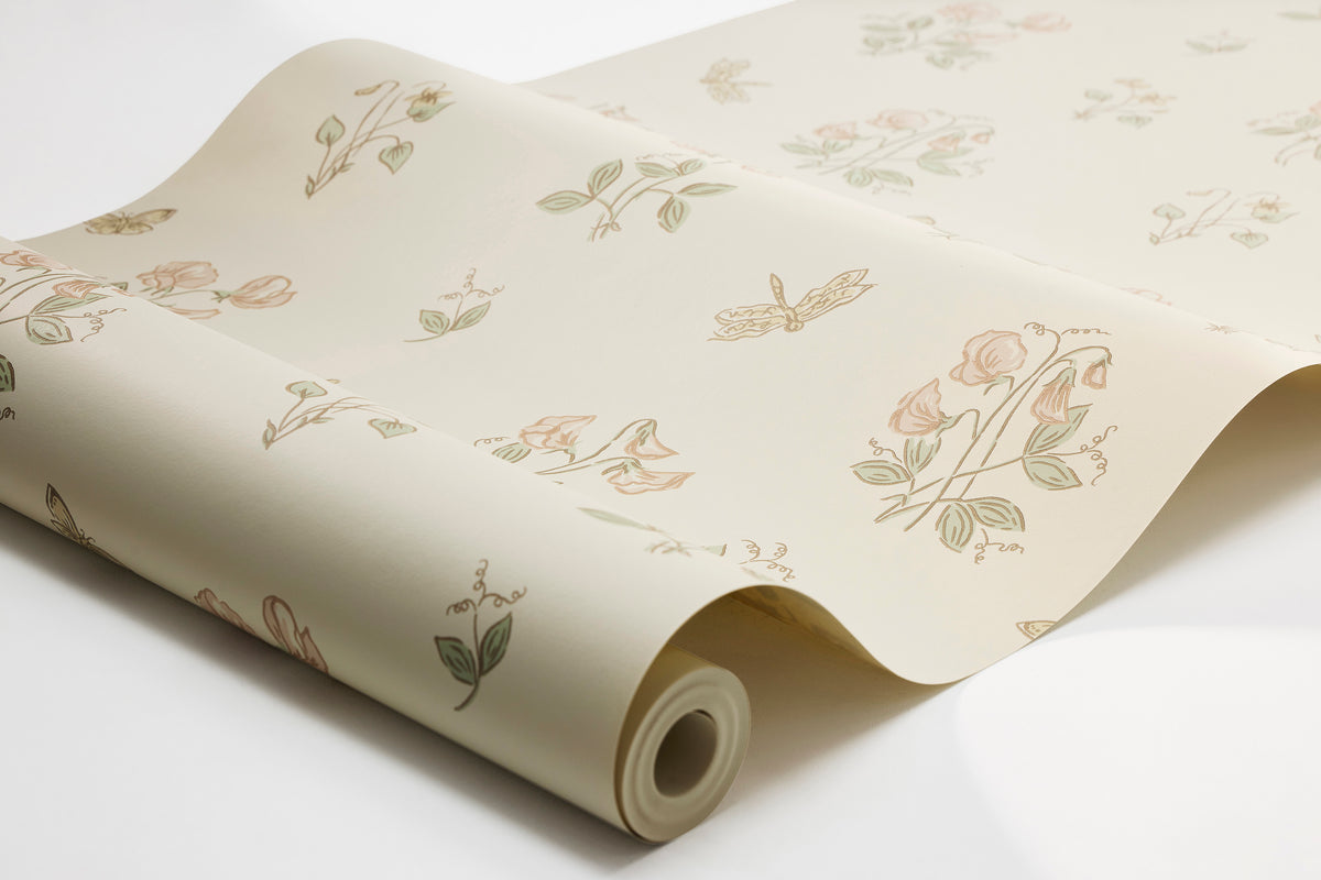 The light, Floral wallpaper Luktärt is adorned with sweet peas, sweet violets, dragonflies and butterflies in soft, warm pastel shades of Pink, green and honey yellow on an off-white background. Delightful and Romantic.