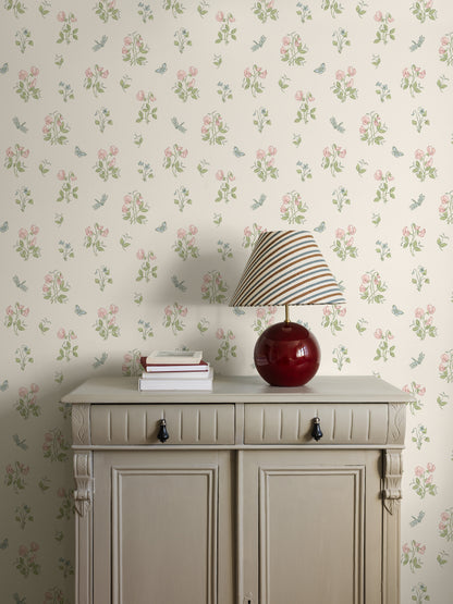  Luktärt is a Romantic, floral wallpaper with an airy pattern of sweet violets, sweet peas, and fluttering dragonflies and butterflies. 