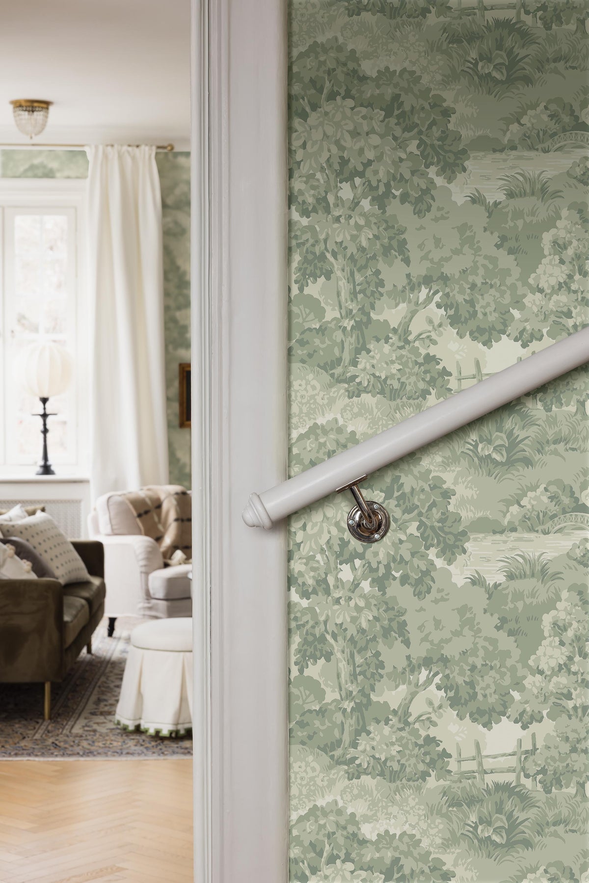  A lush, park-like landscape with large, sculptural trees and beautifully arched bridges covers the beautiful 1940s wallpaper Alnarp. 