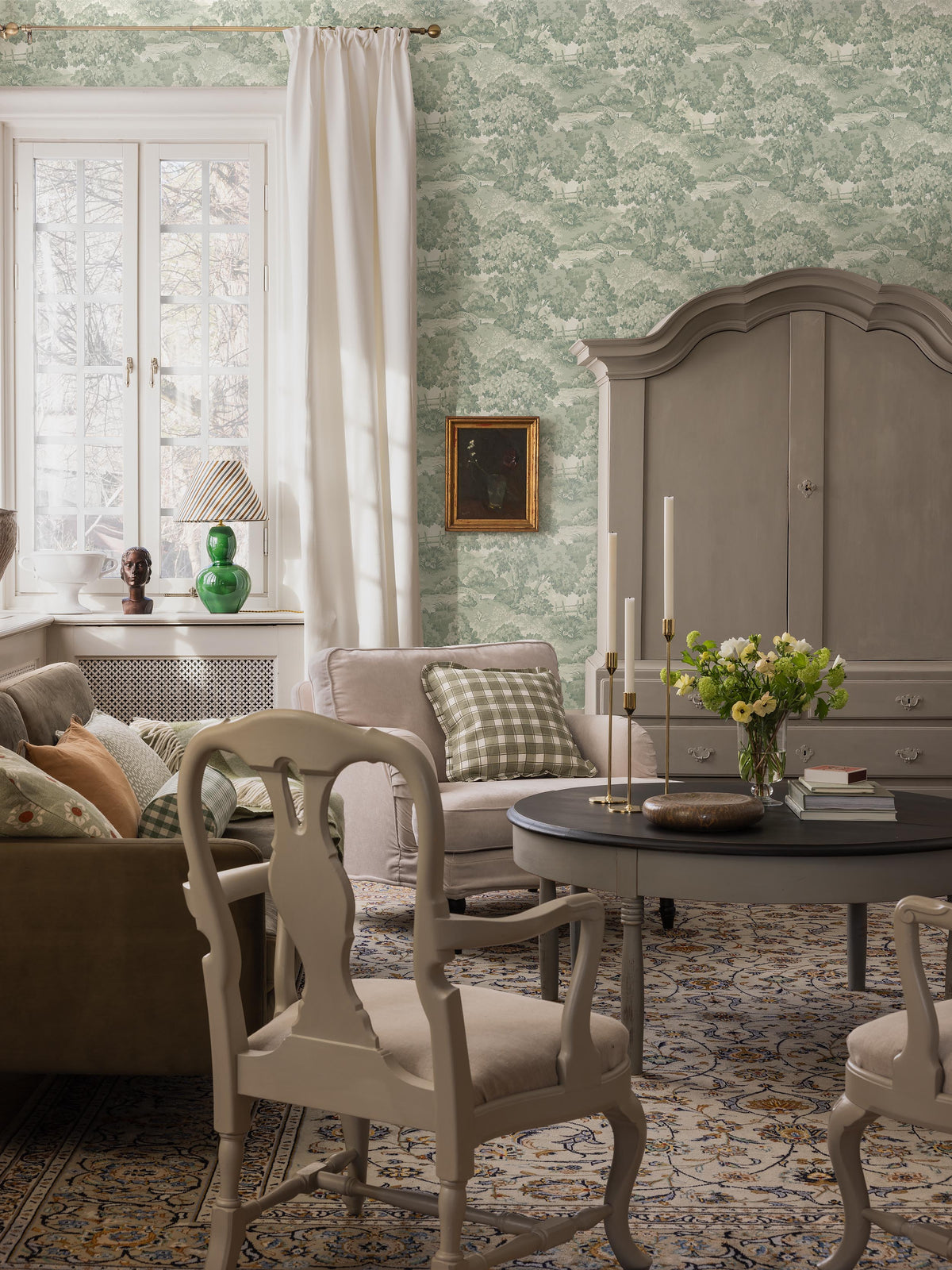  A lush, park-like landscape with large, sculptural trees and beautifully arched bridges covers the beautiful 1940s wallpaper Alnarp. 