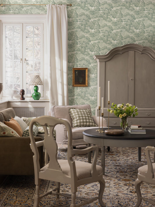  A lush, park-like landscape with large, sculptural trees and beautifully arched bridges covers the beautiful 1940s wallpaper Alnarp. 