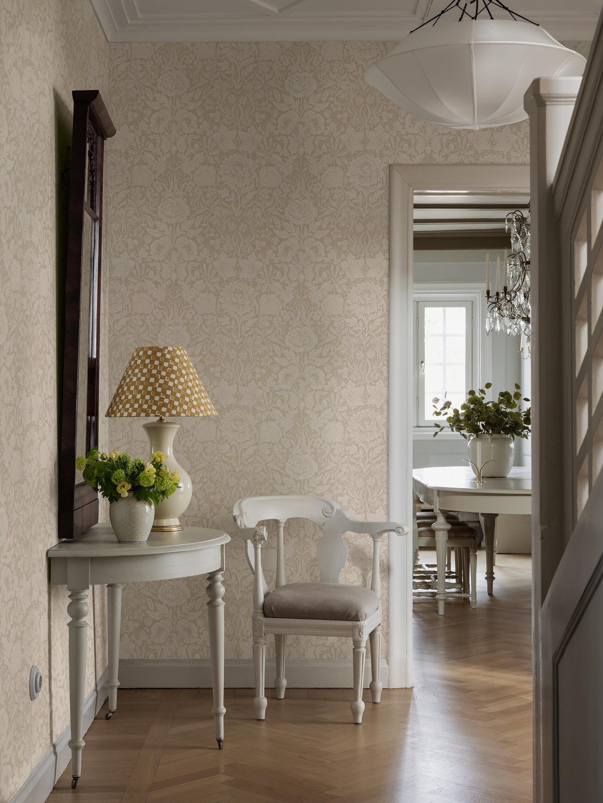 The light, large-floral wallpaper Hildasholm is adorned with a dense Arts and Crafts-inspired pattern made up of peonies, cornflowers, lily of the valley and other local plants from the gardens around Hildasholm manor house in Leksand.
