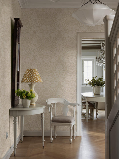 The light, large-floral wallpaper Hildasholm is adorned with a dense Arts and Crafts-inspired pattern made up of peonies, cornflowers, lily of the valley and other local plants from the gardens around Hildasholm manor house in Leksand.