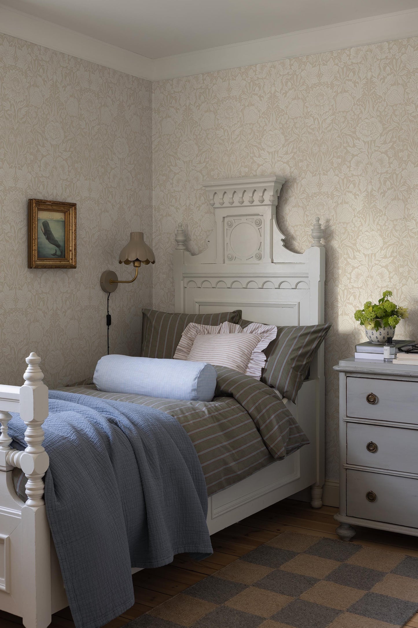 The light, large-floral wallpaper Hildasholm is adorned with a dense Arts and Crafts-inspired pattern made up of peonies, cornflowers, lily of the valley and other local plants from the gardens around Hildasholm manor house in Leksand.