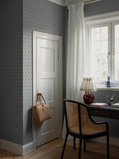 Cecilia is a small-scale floral wallpaper with a rhythmic pattern of sweet little flowers framed by geometric floral garlands.