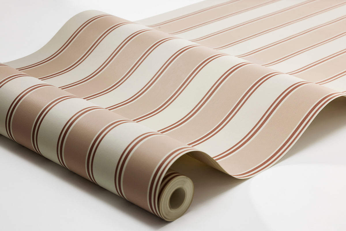  A timeless stripe in a soft, sophisticated color palette adorns the Striped wallpaper Eleonora. 