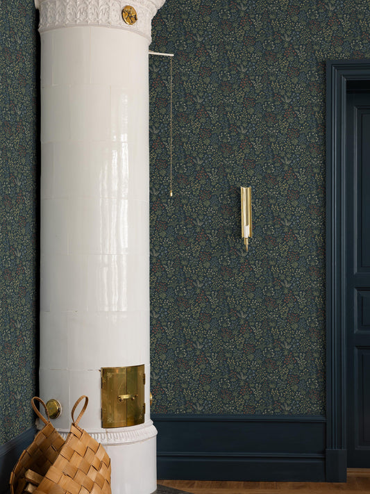 Abundant sweet meadow flowers adorn the dark, small-floral wallpaper Vildflora. 