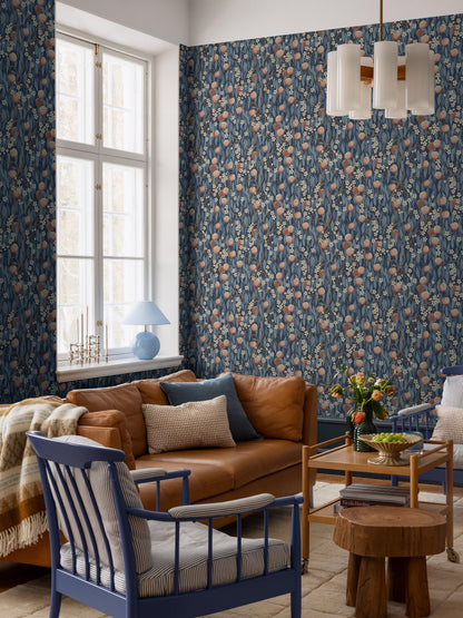 The dark blue Peachtree wallpaper is adorned with apricot-pink peaches and white-pink blossoms in foliage in shades of Blue.