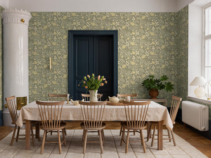 On the green, large-floral wallpaper Blomdansen, the blooms of the peony poppy are joined by beautiful, acanthus-like leaves and delicate bell-shaped flowers on slender stems.