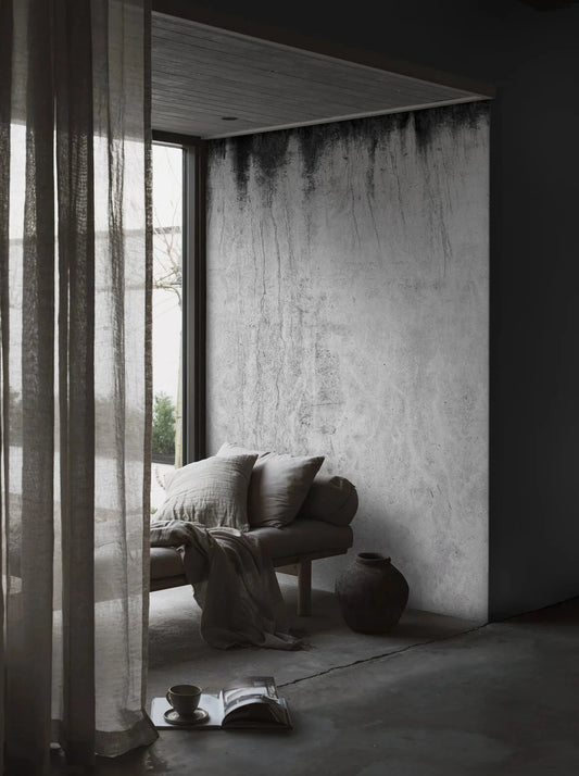The photo wallpaper Dark Concrete is created from a high-resolution close-up of a patinated concrete surface.