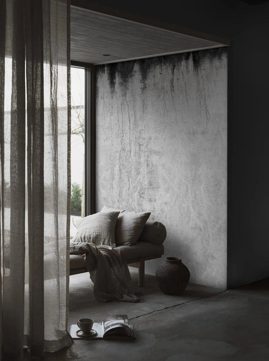 The photo wallpaper Dark Concrete is created from a high-resolution close-up of a patinated concrete surface.