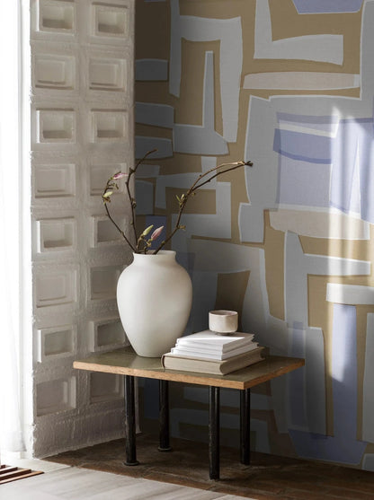 Retro Vibes wallpaper depicts a large-scale, geometric pattern with a distinctly retro feel, and comes in pale orange, purple and white.