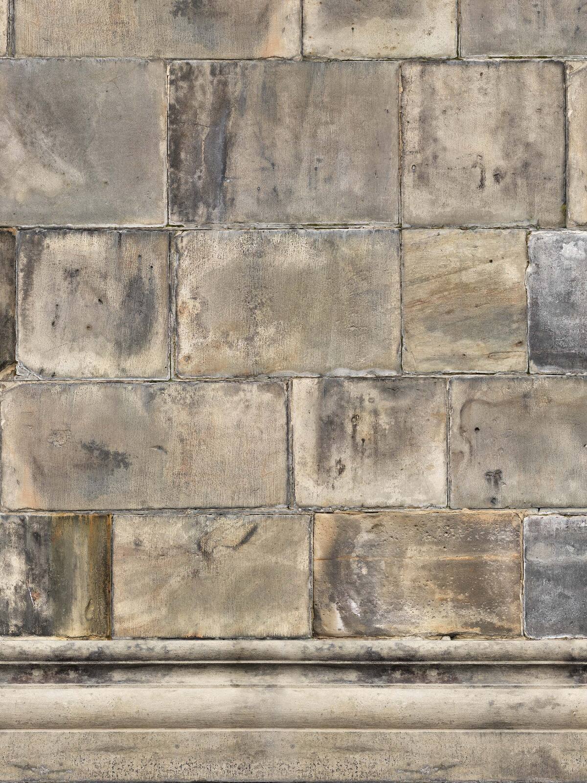 The photo wallpaper Sandstone Bricks depicts a beautifully patinated sandstone wall from Lund Cathedral.