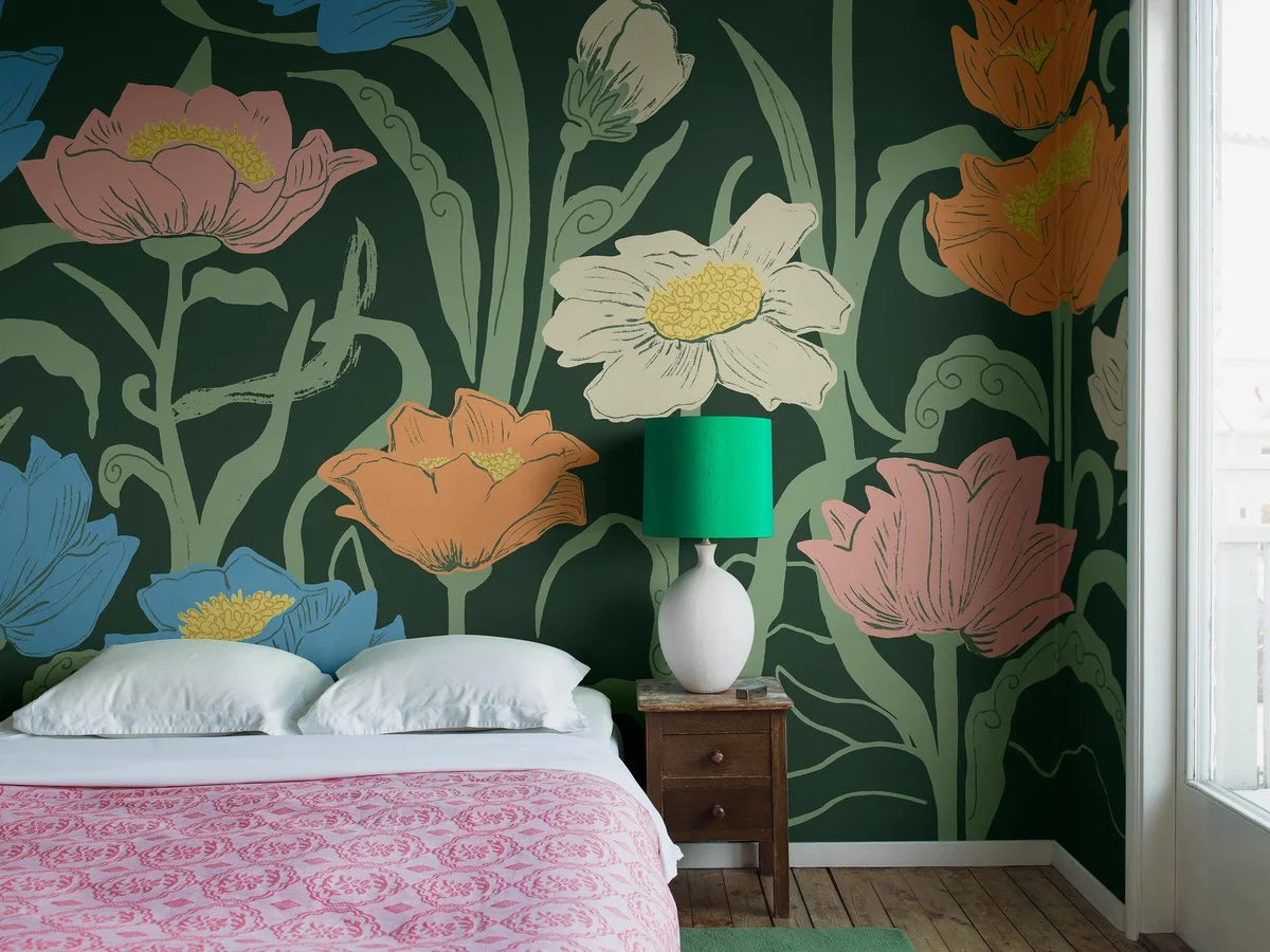 Set against a background of rich muted green, Astrid Wilson’s hand-painted Buttercup pattern showcases a large-scale design with a modern feel.