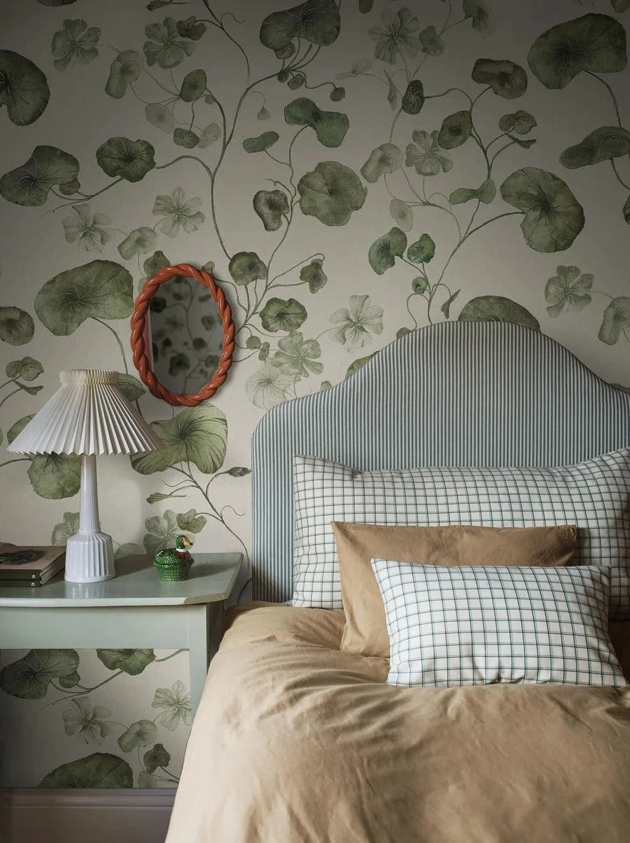 My Feldt's floral wallpaper, Grönska, is covered with green, winding nasturtium. 