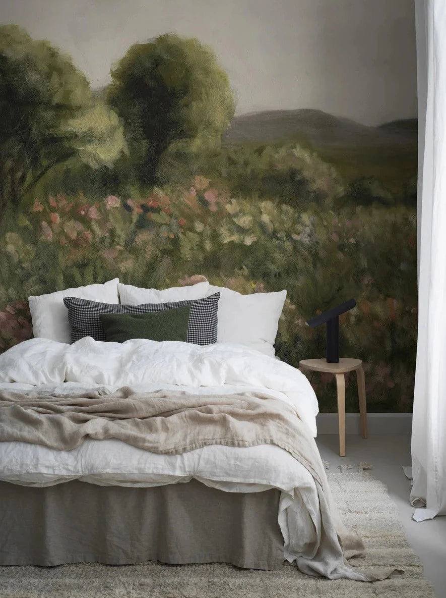 The wallpaper Agnes Meadow is like a giant oil painting where the blooming meadow transitions into green trees and then fades into rolling hills far beneath the bright clouds.