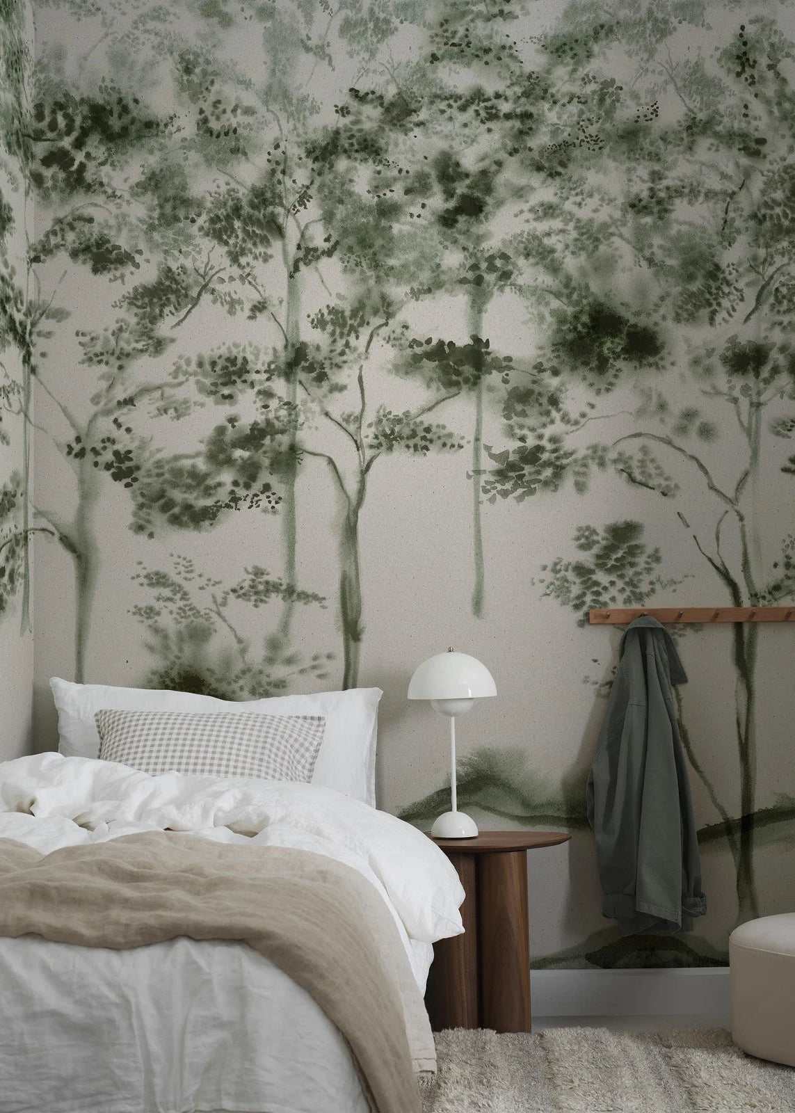 The Ink Forest mural brings a calm, dreamy atmosphere to any space with its stylised trees stretching from floor to ceiling, like a misty, open woodland.