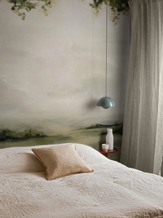 The mural wallpaper Glade Landscape depicts a dreamy view of an open, slightly hazy landscape – like an abstract oil painting, large enough to cover the entire wall from floor to ceiling. 