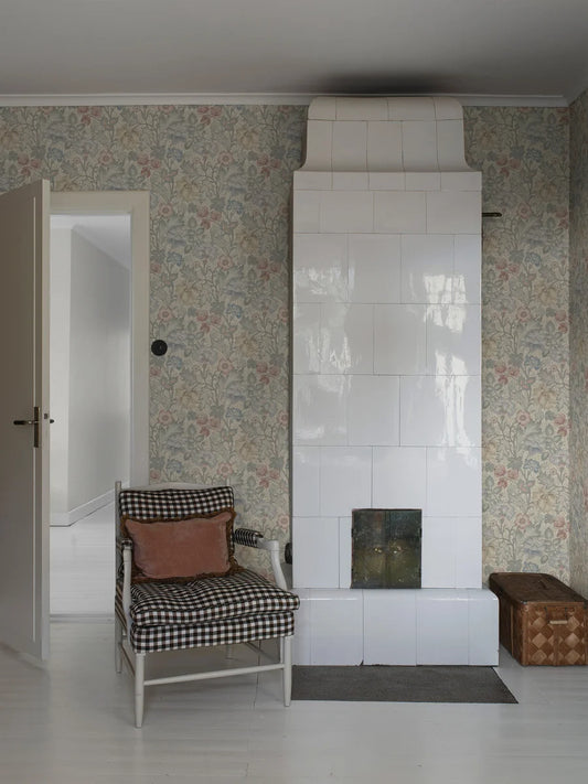 Featuring florals in muted shades of blue, yellow and red set on a soft, light grey-beige background, our Jane wallpaper is sophisticated and elegant yet full of cosy expression.