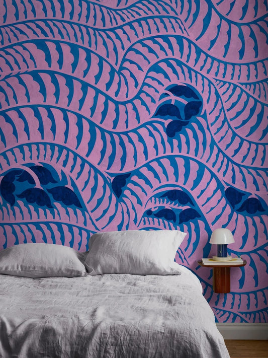 Garden Bell is a vibrant, graphic mural wallpaper featuring a flowing pattern designed by Cecilia Pettersson. 