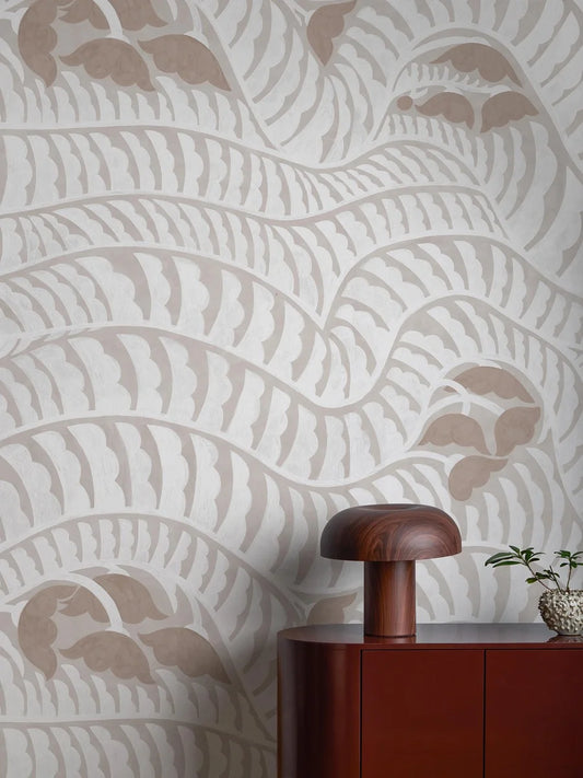 The light, graphic Garden Bell wallpaper is covered from floor to ceiling in a flowing, abstract pattern – like a meandering walk along winding gravel paths and blooming gardens