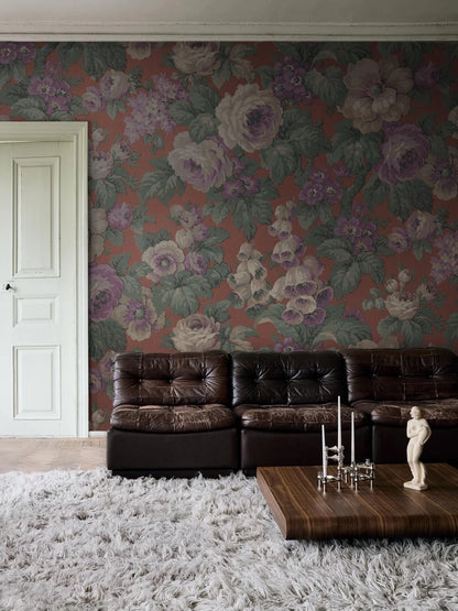 The large-flowered wallpaper Rose Magnifique is covered in roses, foxgloves, and other blooms in a lively, lush pattern