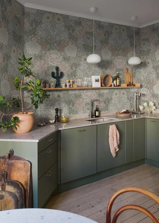 Here, Dahlia Garden Grand wallpaper mural comes in a muted palette of rose red, pale yellow, and gray-green on a beige background.