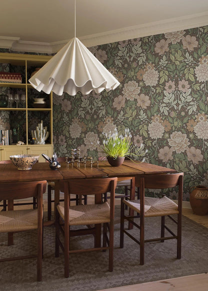 Dahlia Garden Grand mural Wallpaper's color palette is warm, soft, and inviting: pink, cream, light terracotta, and warm green shades on a dark background. The wallpaper is custom fit to your wall.