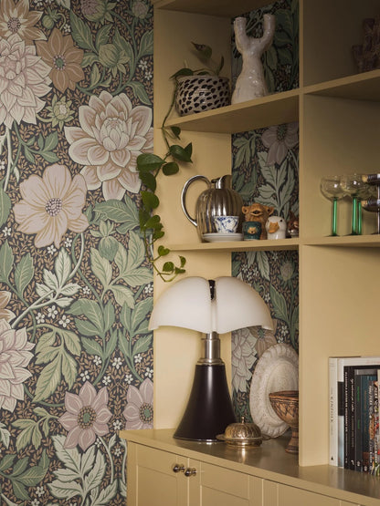 Dahlia Garden Grand mural Wallpaper's color palette is warm, soft, and inviting: pink, cream, light terracotta, and warm green shades on a dark background. The wallpaper is custom fit to your wall.
