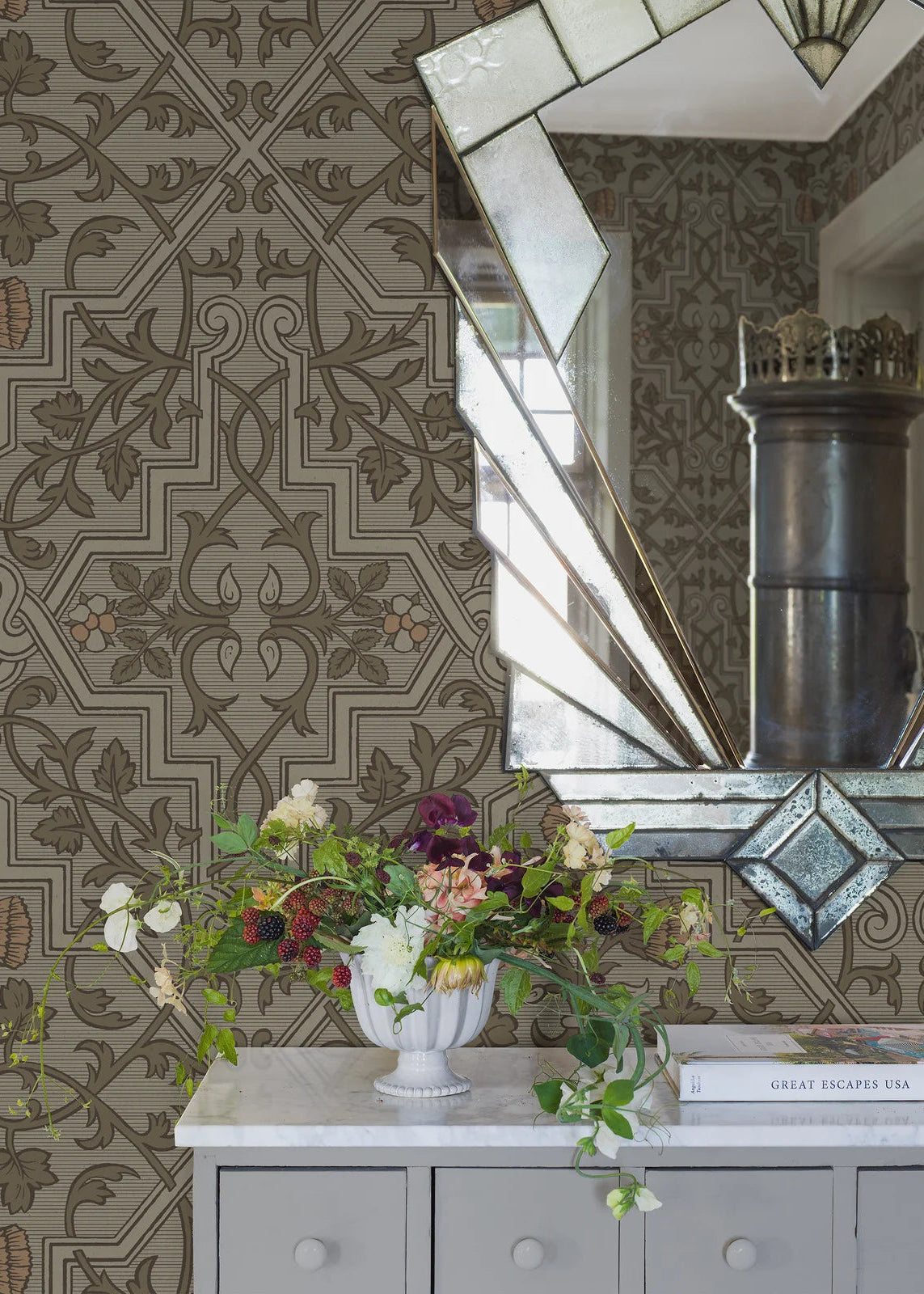 Rosenvinge Grand Wallpaper mural here unfolds in a soft, natural color scheme with details in green and apricot on a light grey-green background.