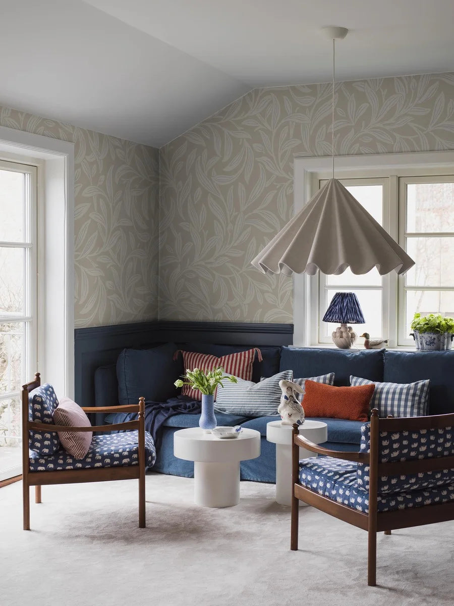 The light Vintergröna Grand features a large-scale, winding foliage pattern with clear Arts &amp; Crafts influences. The wallpaper is an enlarged reprint of Vintergröna and is custom fit to your wall.