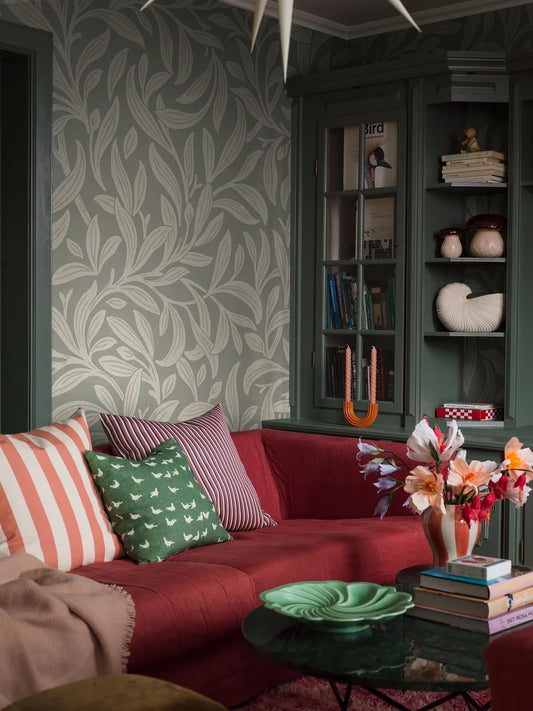 Vintergröna Grand’s winding foliage wraps the room in harmony. The Arts &amp; Crafts-inspired motif is borrowed from the Vintergröna wallpaper, and Vintergröna Grand is an enlarged digital reprint of it.
