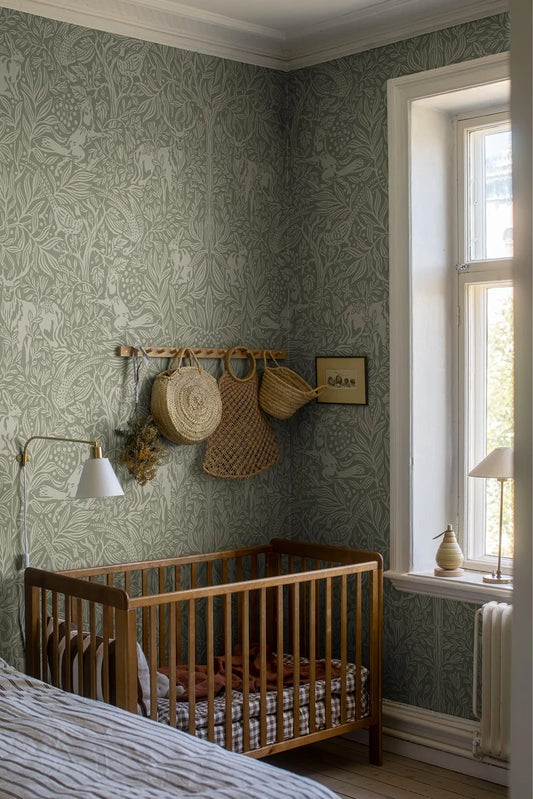  Under the Elder Tree Grand is a boldly patterned wallpaper, covered in lush foliage filled with playful animals. 